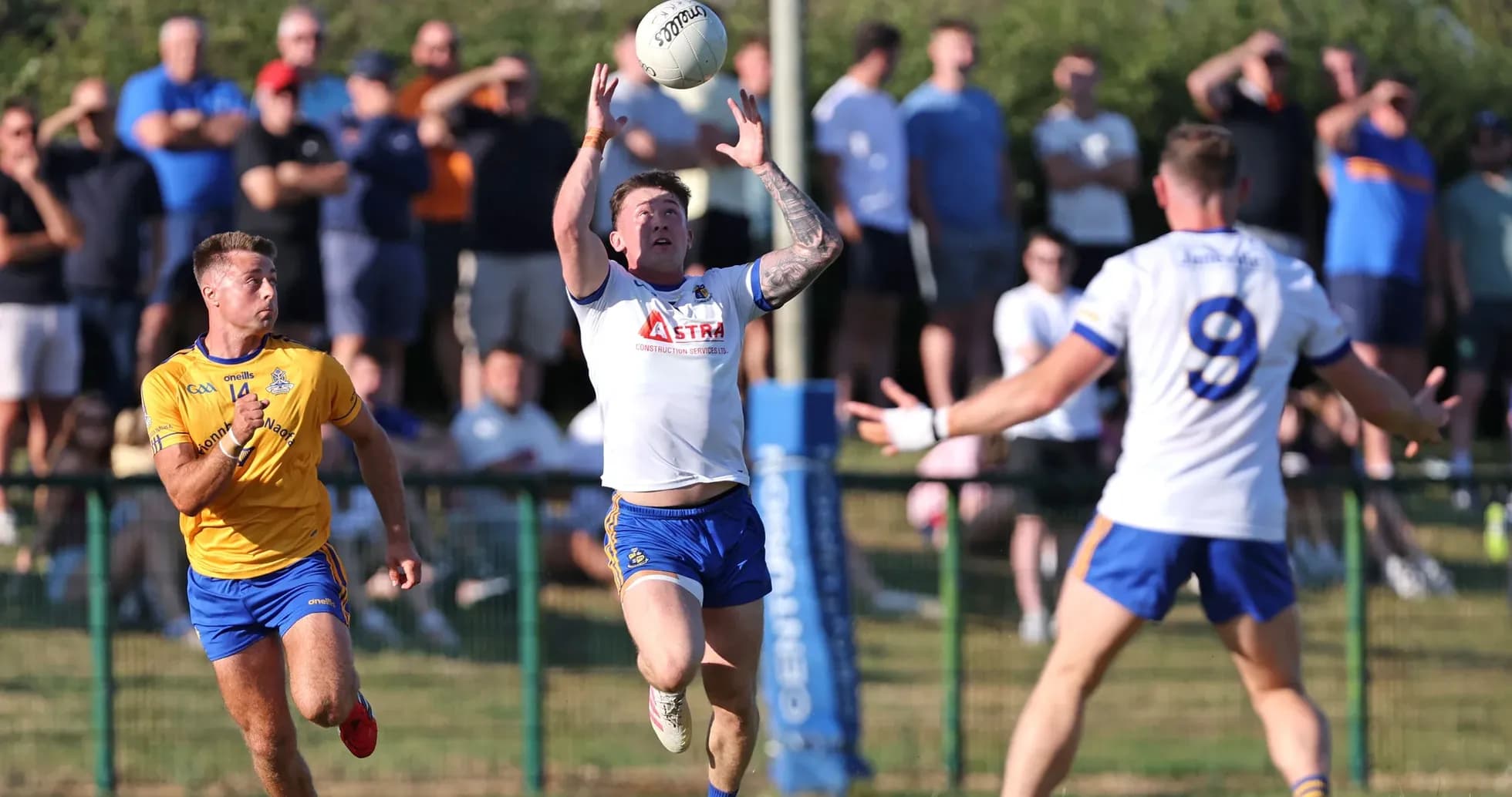 Player catching ball during Gaelic football match
