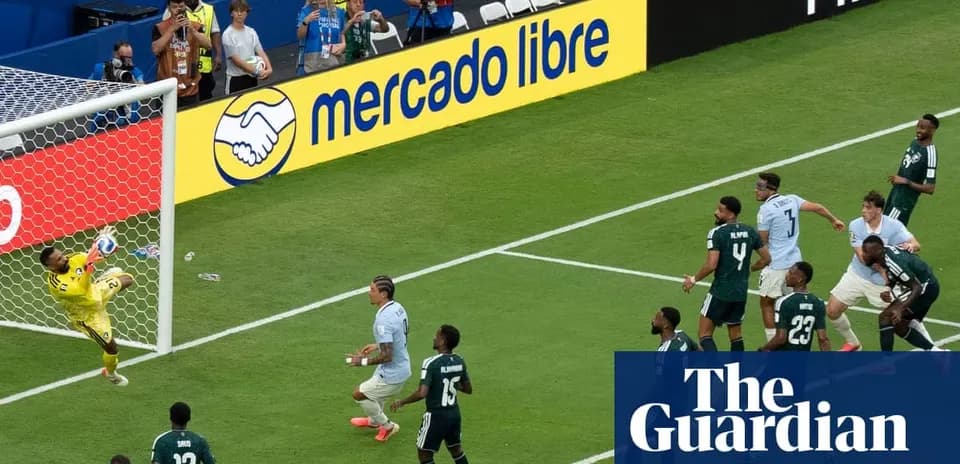 Goalkeeper saving a shot during football match