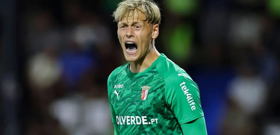 Goalkeeper shouting during a match in green kit