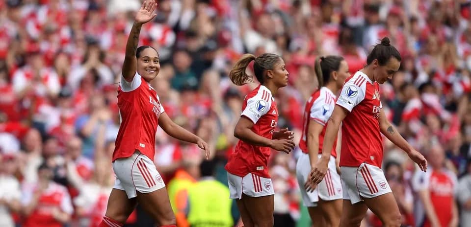 Arsenal players celebrating a goal at stadium