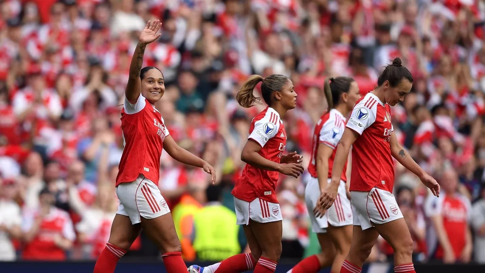 Arsenal players celebrating a goal at stadium