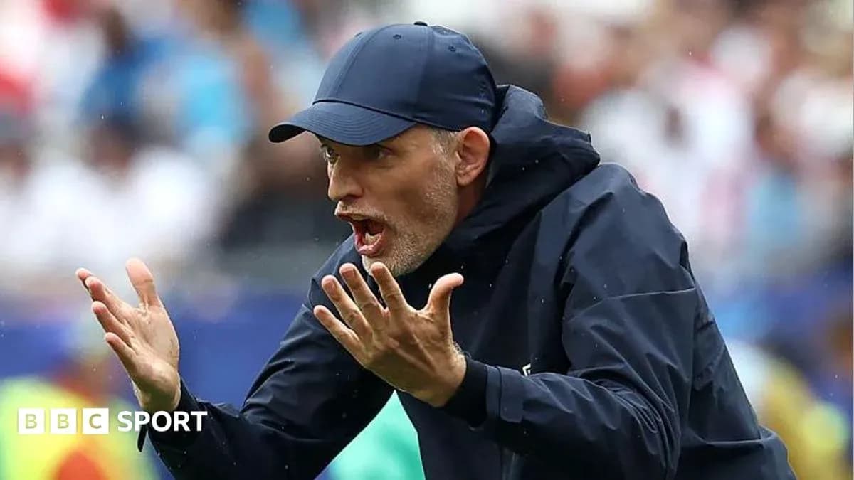 Coach giving instructions on the sidelines during match