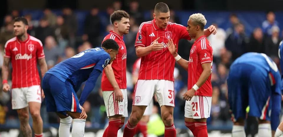 Players discussing strategy during a match stoppage