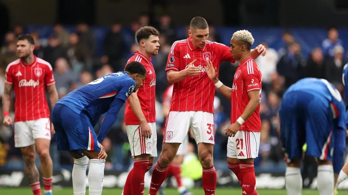 Players discussing strategy during a match stoppage
