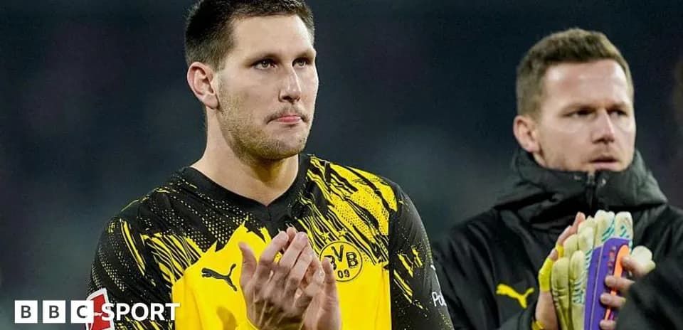 Goalkeeper applauding fans after the match