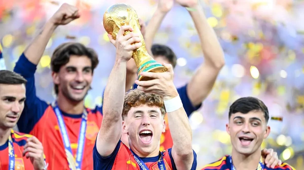 Spain players celebrating with FIFA World Cup trophy