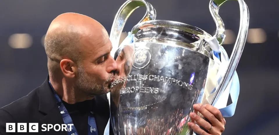 Men's football coach kissing UEFA Champions League trophy