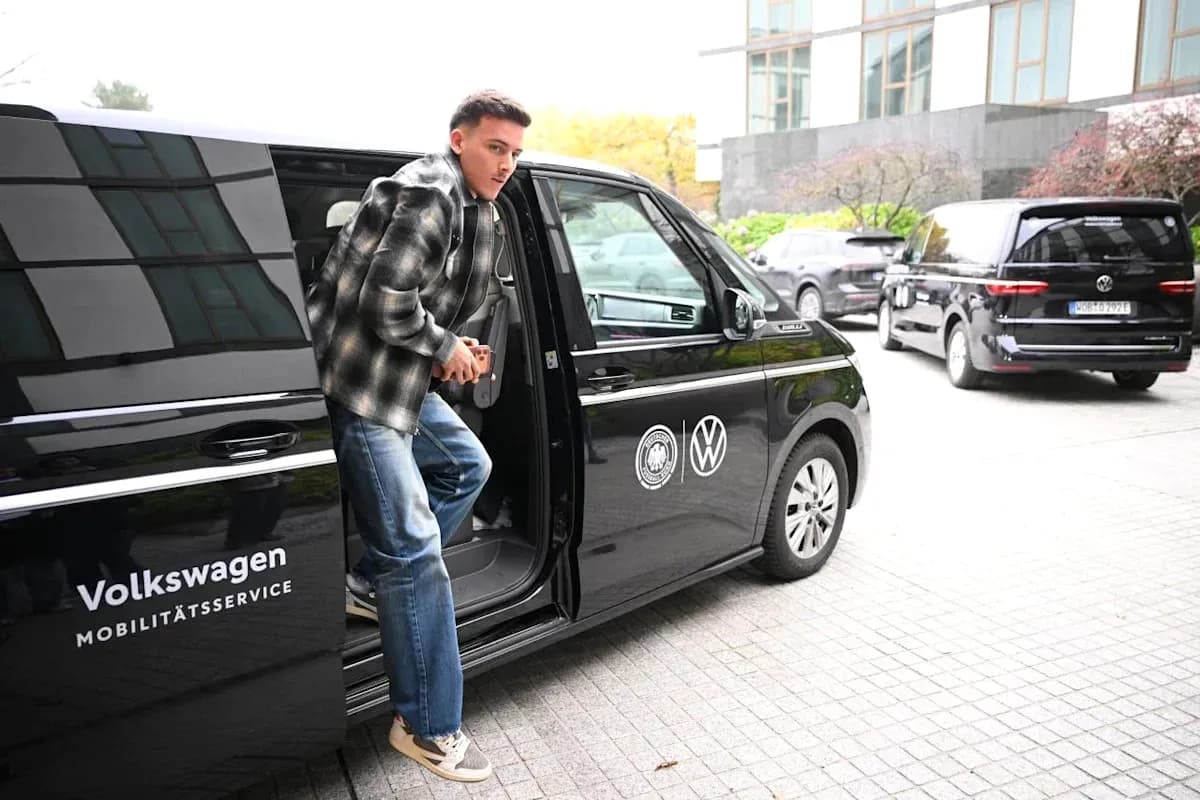 Player exiting Volkswagen vehicle at location