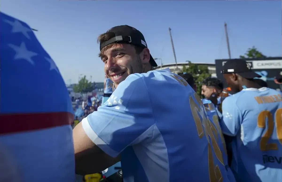 Player smiling during celebration event outdoors