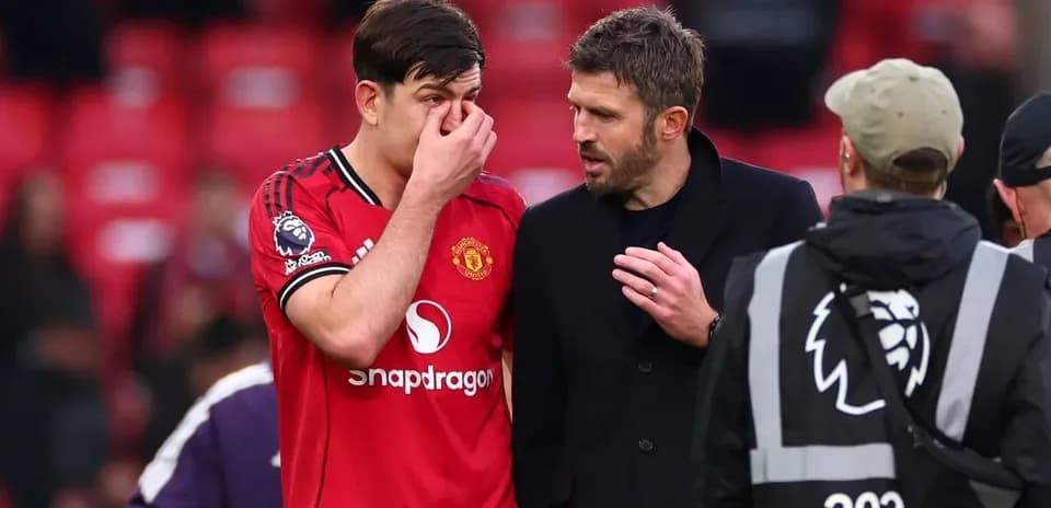 Harry Maguire speaking with Michael Carrick post-match