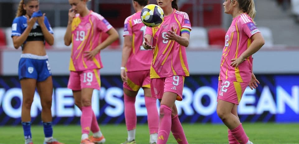 Players in pink jerseys during a match moment