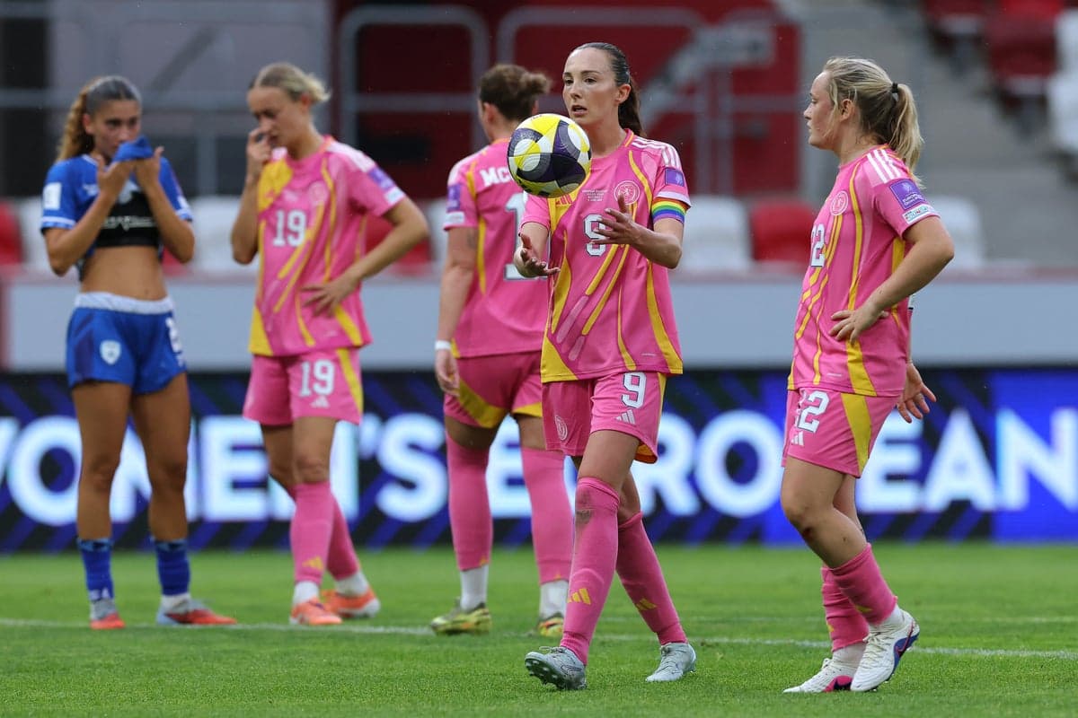 Players in pink jerseys during a match moment
