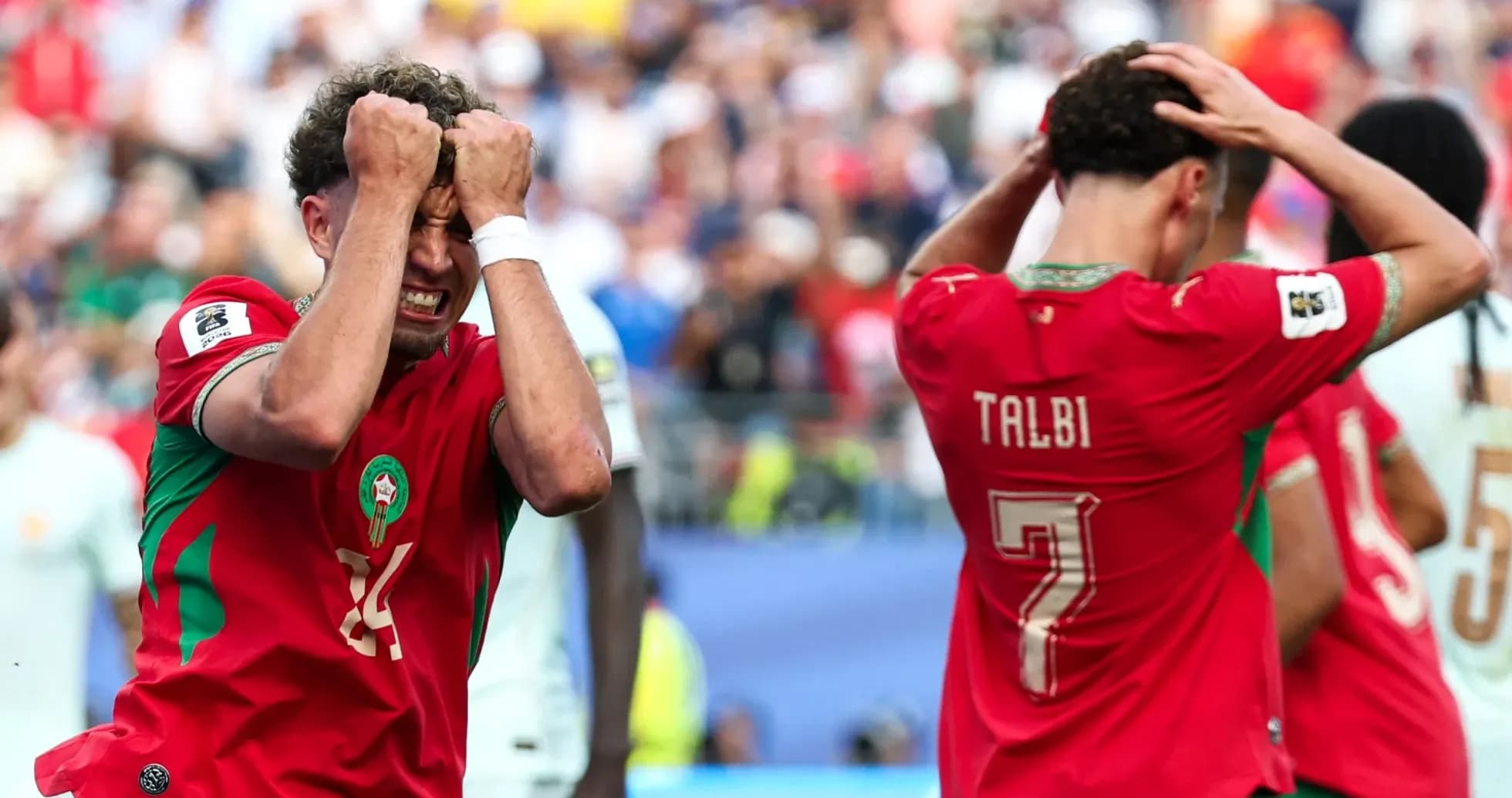 Moroccan players reacting after missed opportunity during match