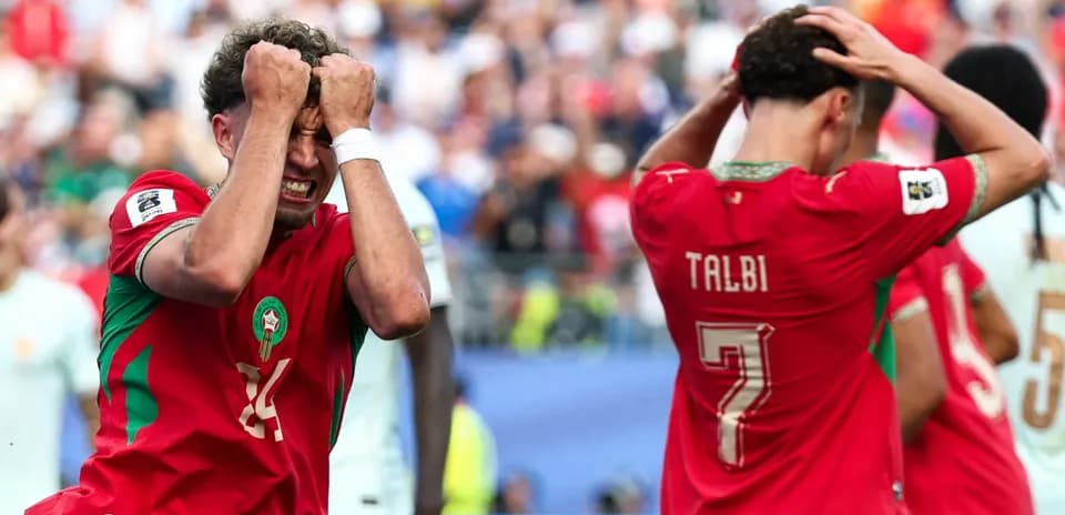 Moroccan players reacting after missed opportunity during match
