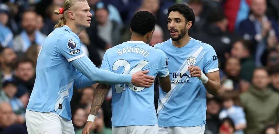 Manchester City players discussing during a match