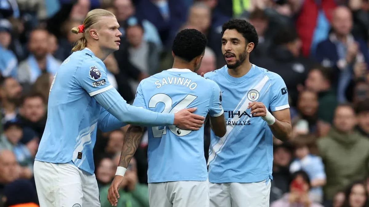 Manchester City players discussing during a match