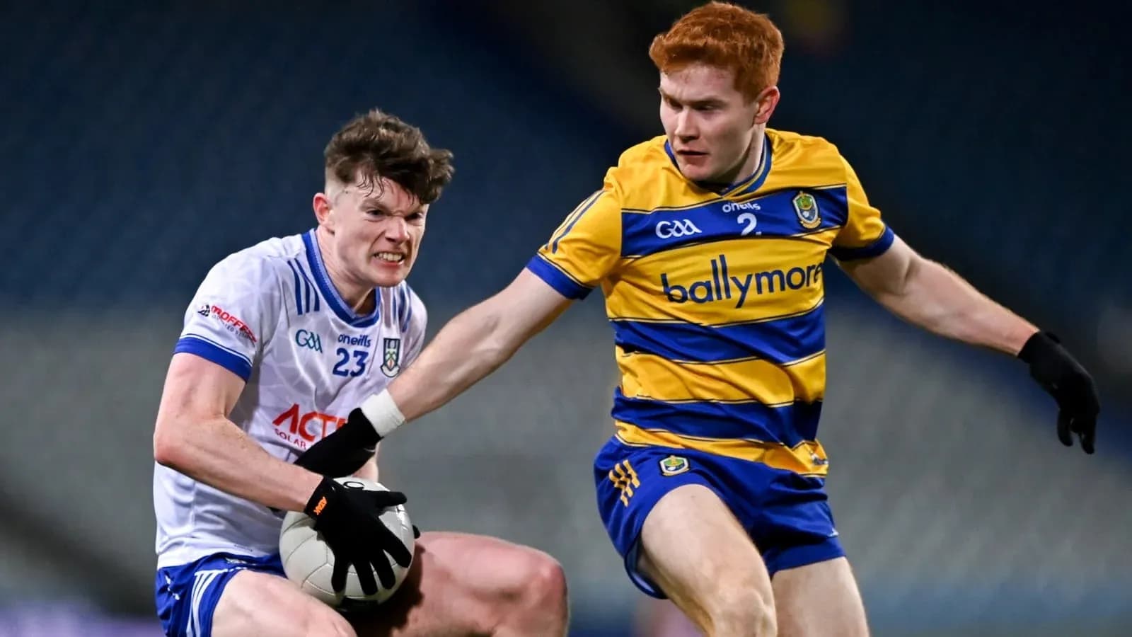 Two players contesting for the ball during a match