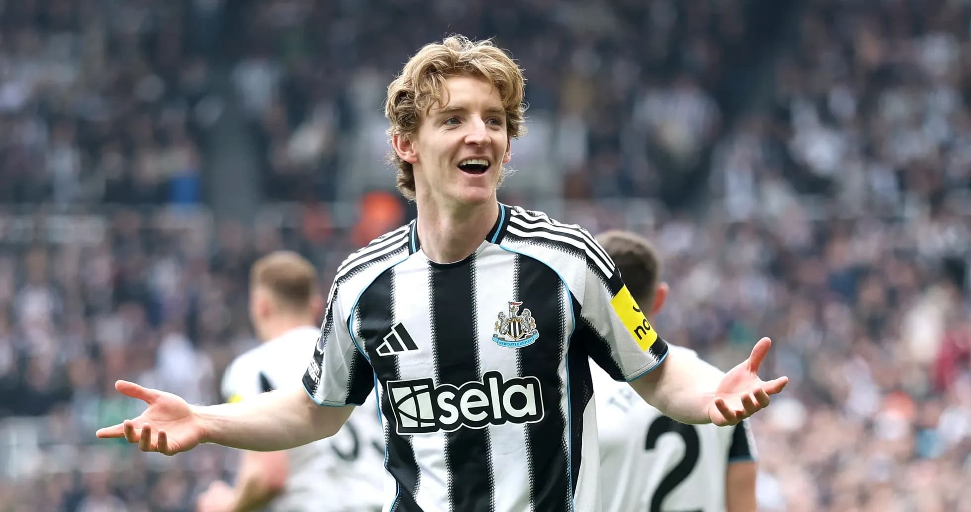 Newcastle player celebrating in front of fans