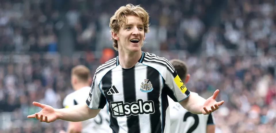 Newcastle player celebrating in front of fans