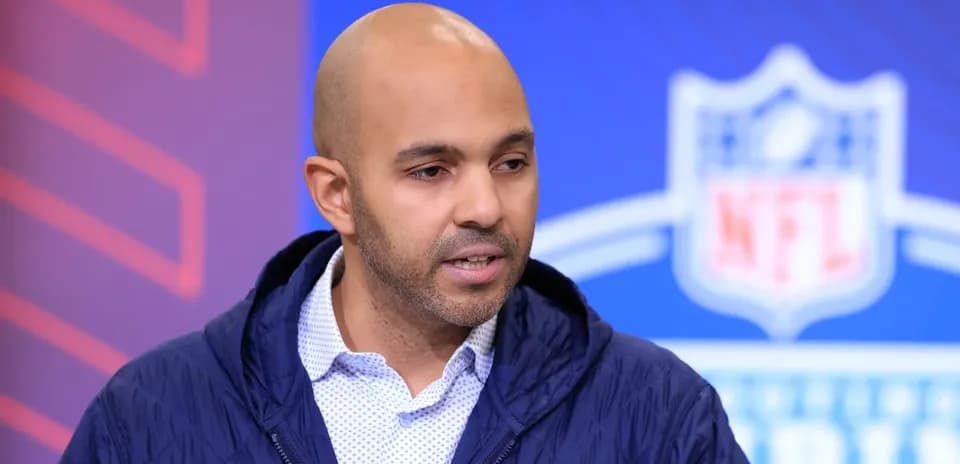 Analyst speaking at NFL event backdrop