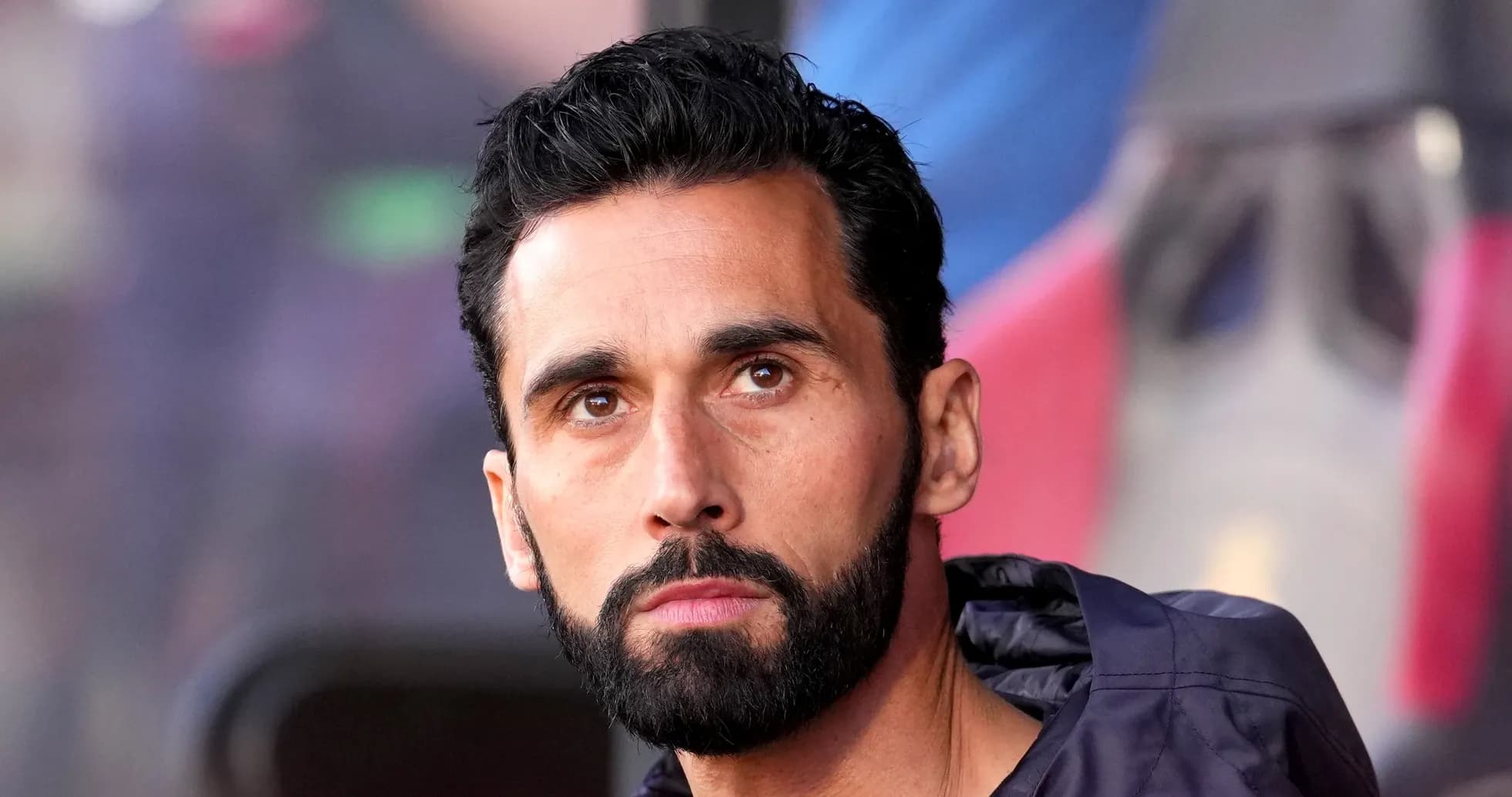 Football player sitting on the bench during match