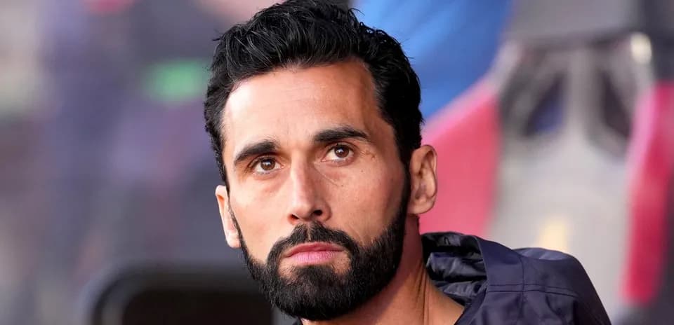 Football player sitting on the bench during match