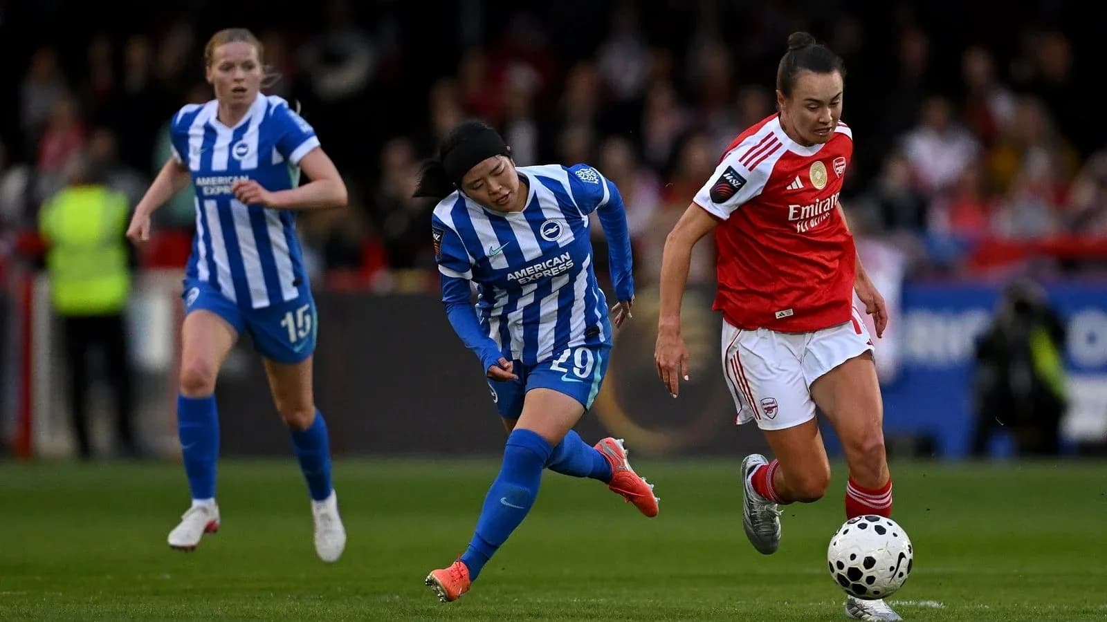 Two players competing for the ball in match