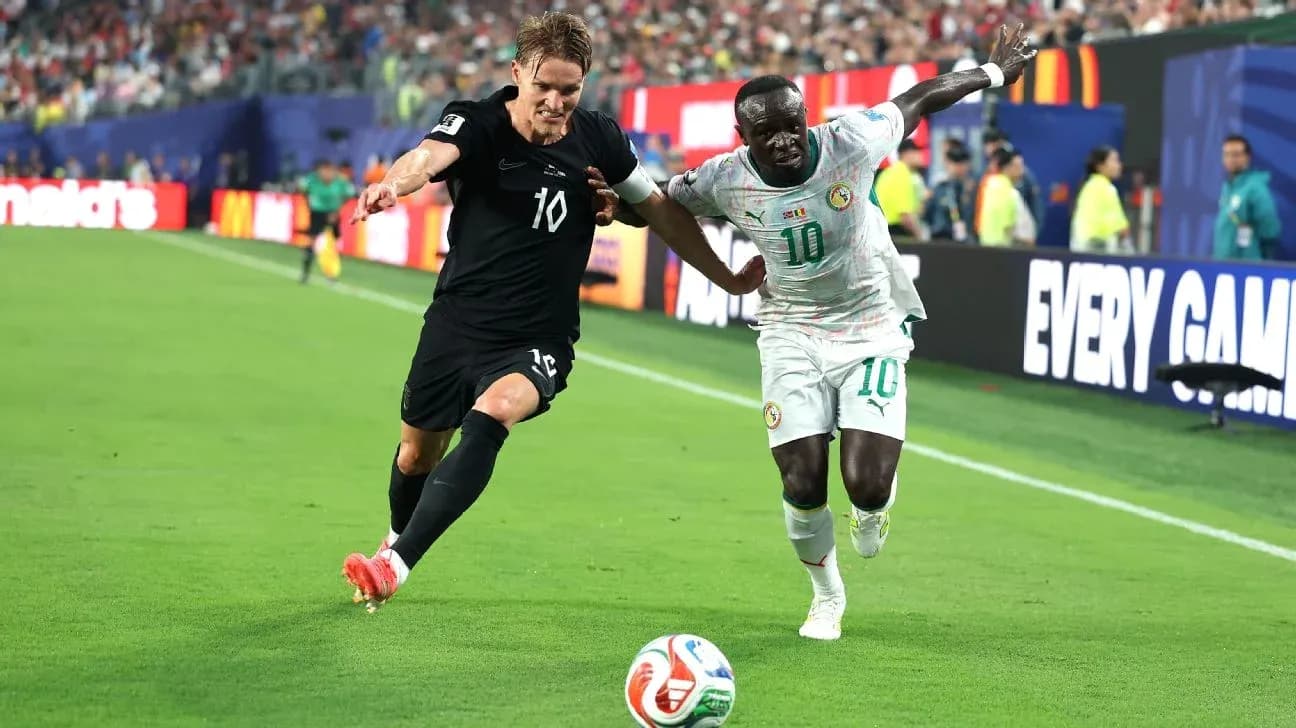 Two players contesting the ball on the field