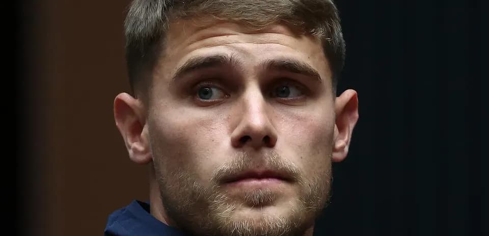 Player wearing Tottenham jacket during event