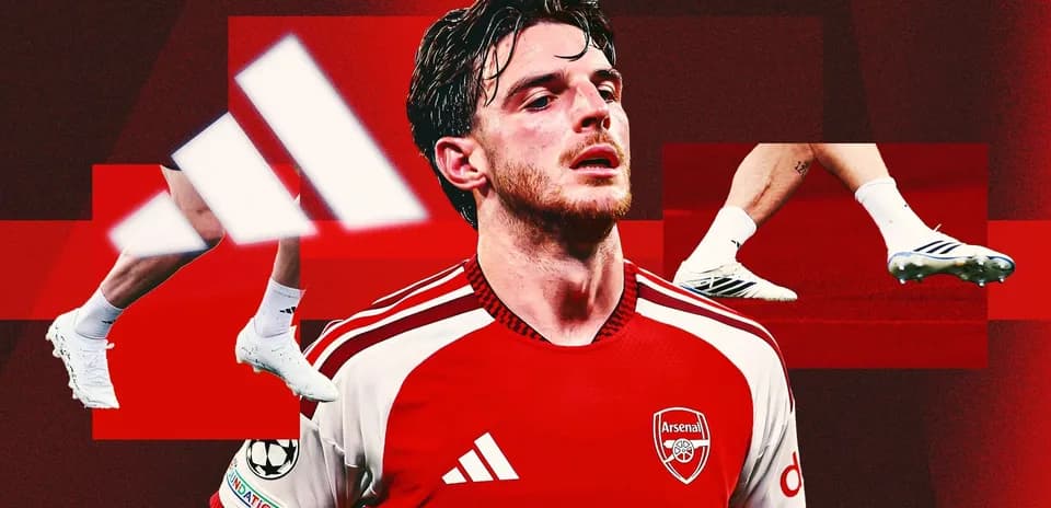 Arsenal player in red kit with Adidas logo
