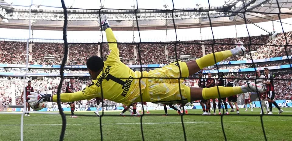 Goalkeeper diving to save a penalty kick