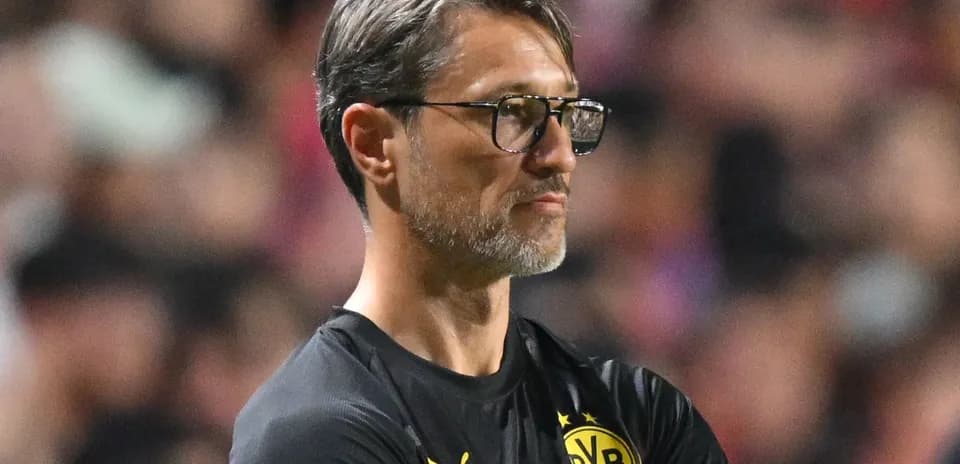 Borussia Dortmund coach observing the match