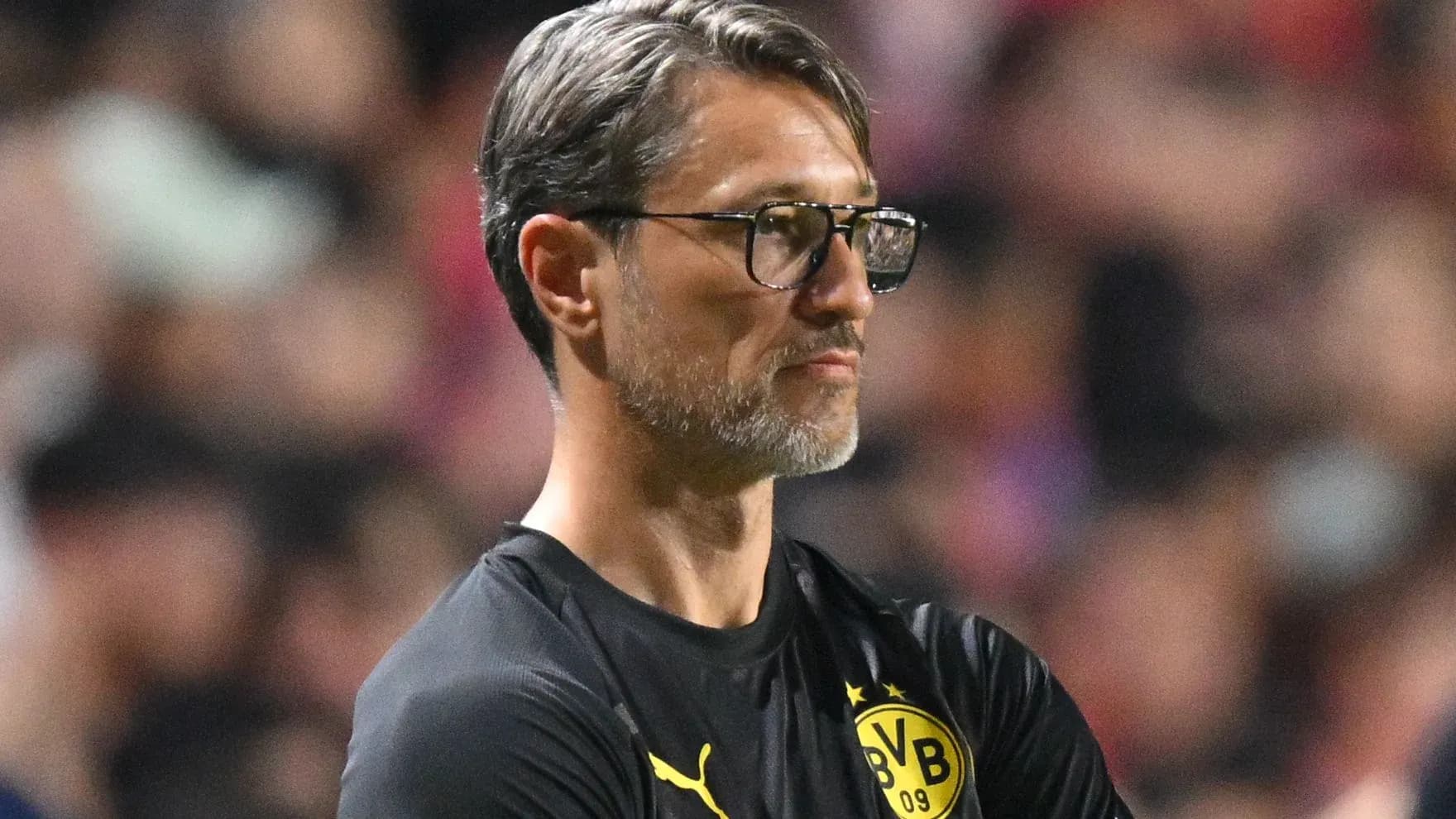 Borussia Dortmund coach observing the match