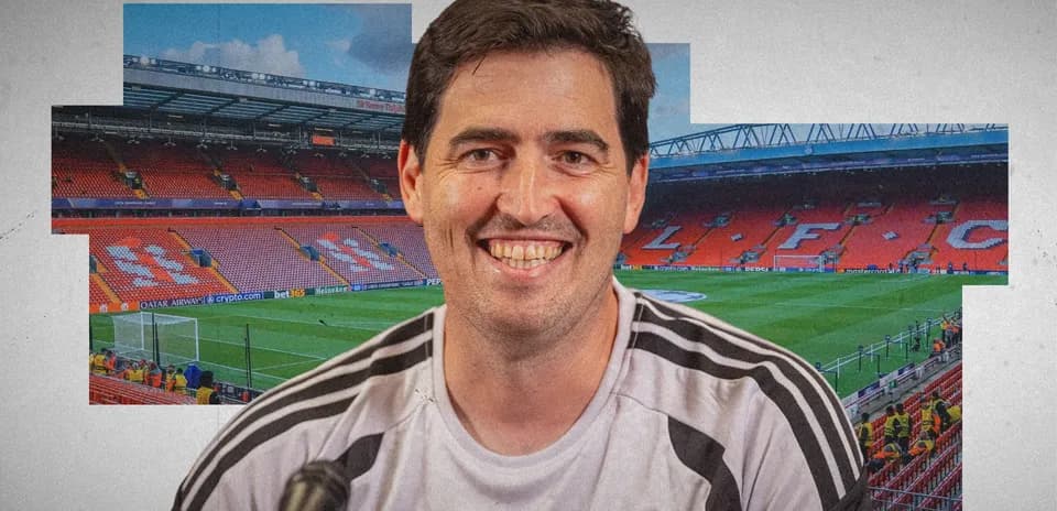 Person smiling with Anfield stadium in background