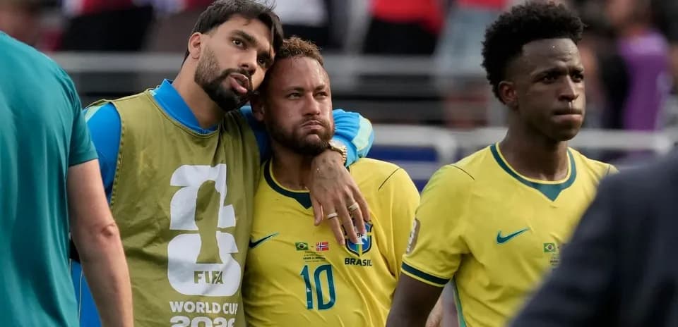 Brazil players discussing after match in yellow jerseys