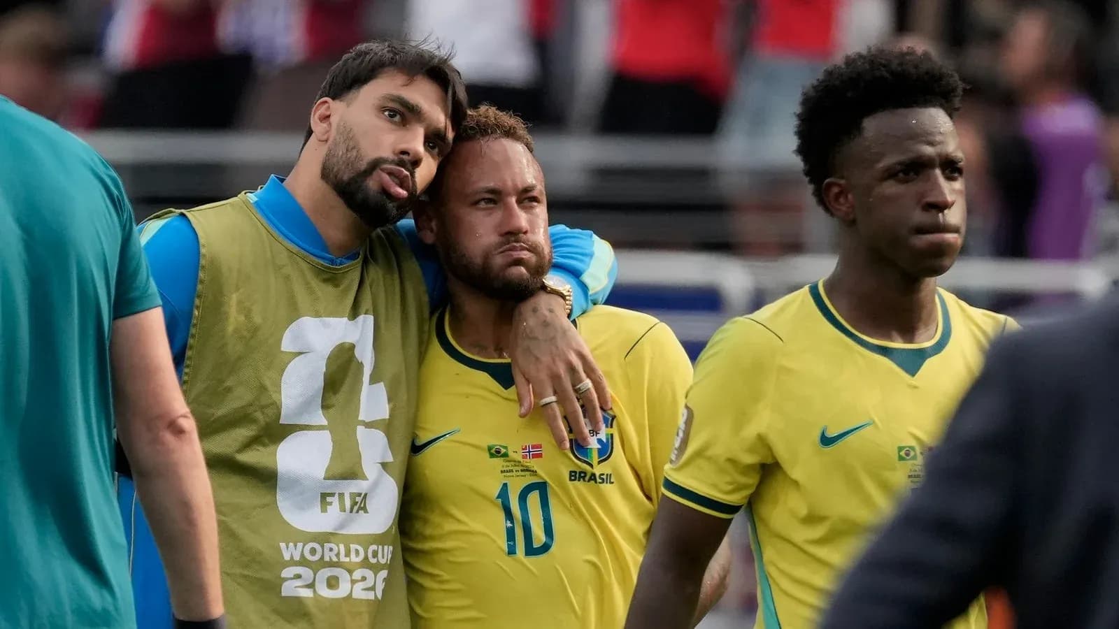 Brazil players discussing after match in yellow jerseys