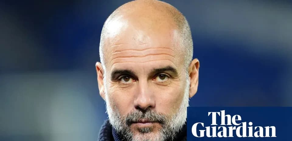 Coach with a beard looking directly at camera