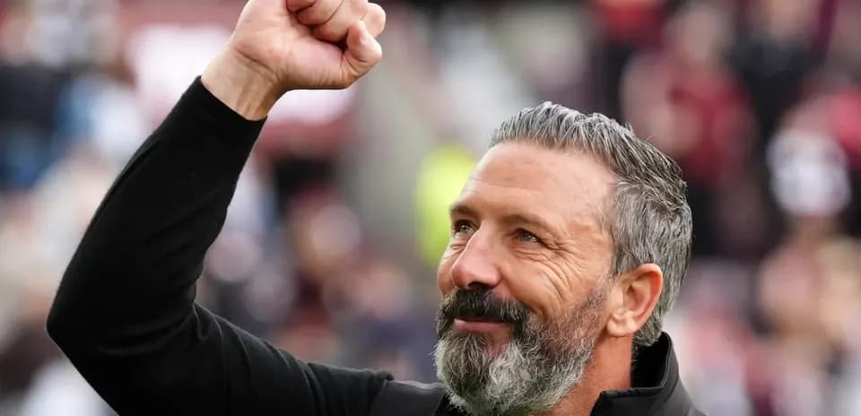 Coach celebrating with raised fist during match
