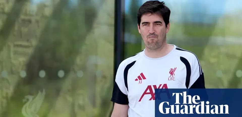 Liverpool coach walking outside training facility