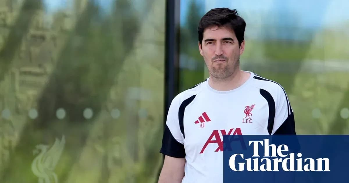 Liverpool coach walking outside training facility