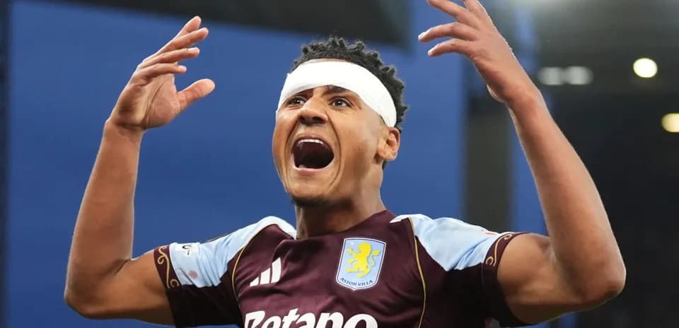 Aston Villa player celebrating with raised arms