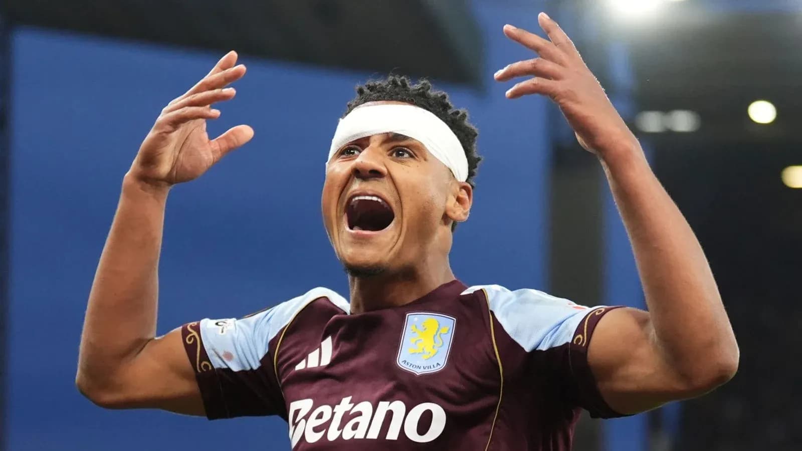 Aston Villa player celebrating with raised arms