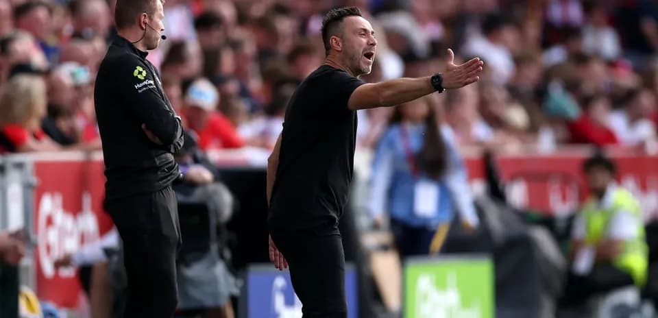Coach gesturing during a match on the sidelines