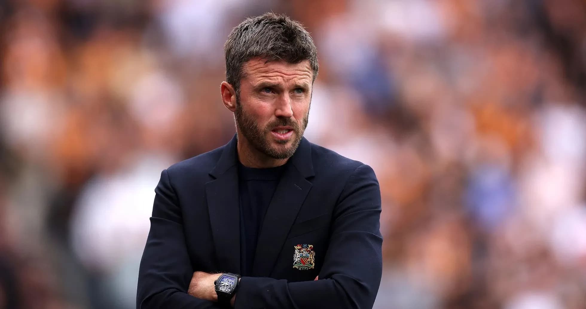 Football manager observing the match from sidelines