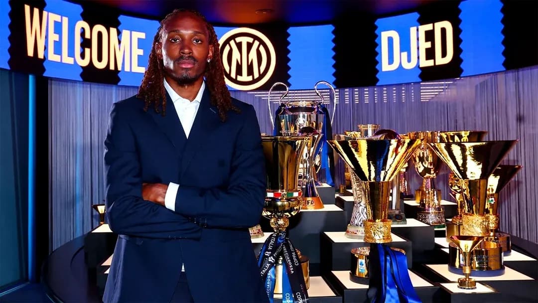 New player posing with trophies at presentation event
