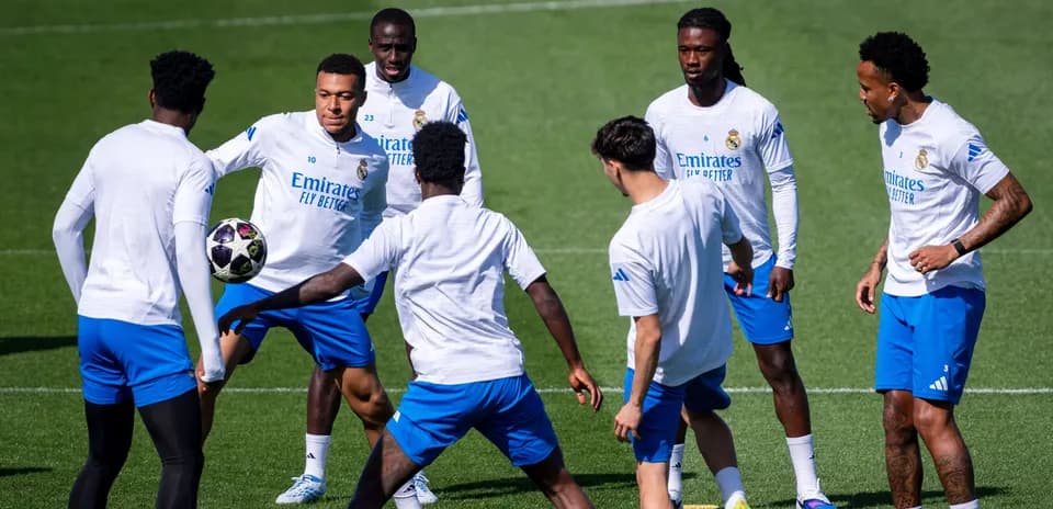 Real Madrid players practicing with a soccer ball