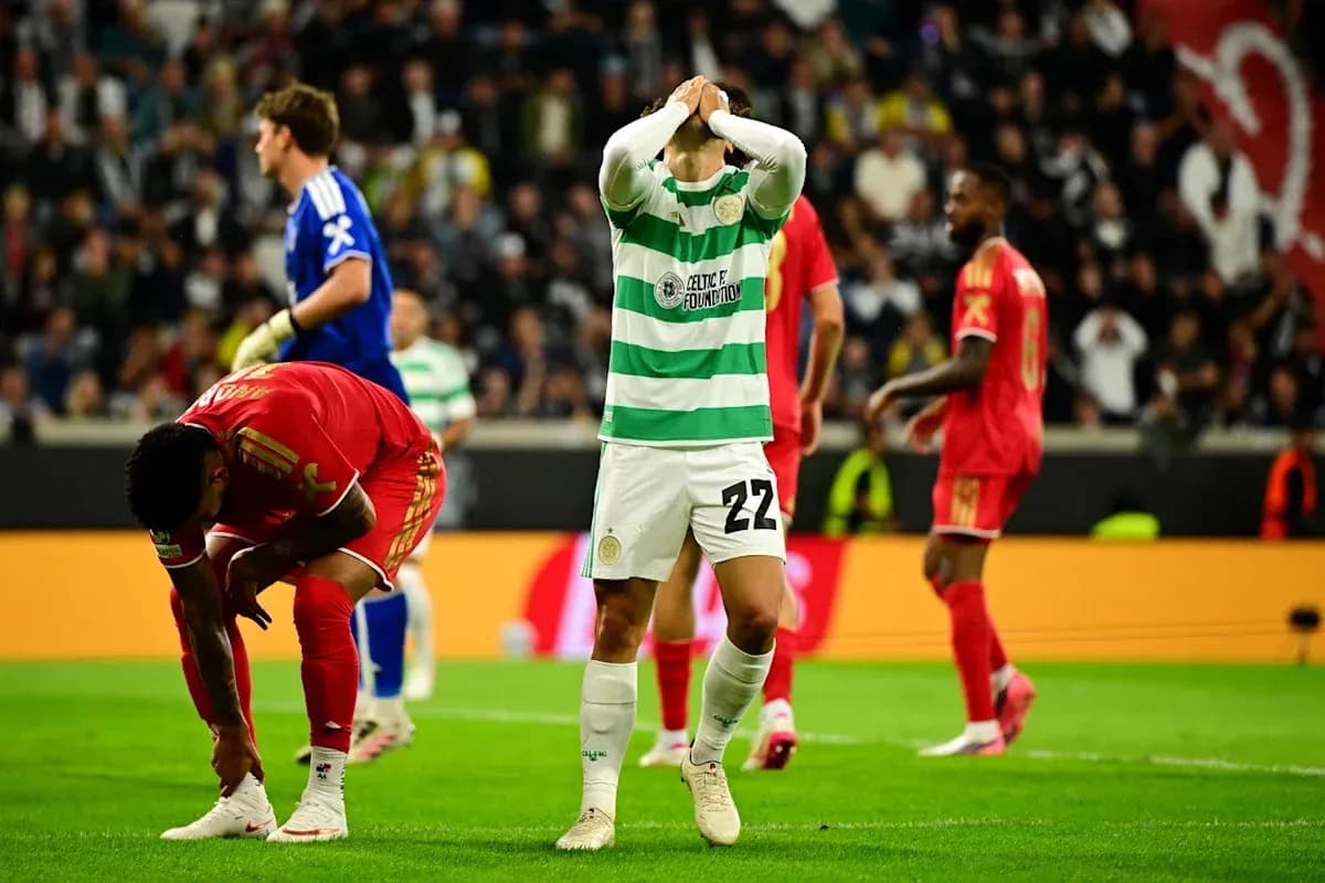 Celtic player reacting during match, teammates in background