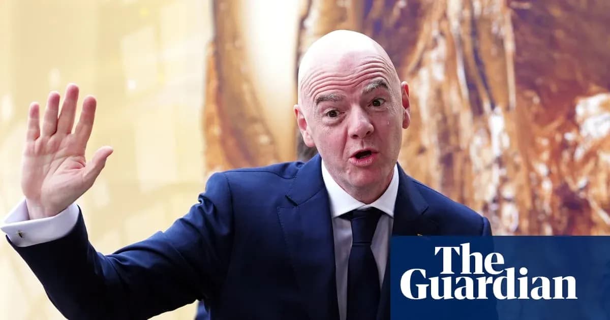 FIFA president speaking at event with raised hand