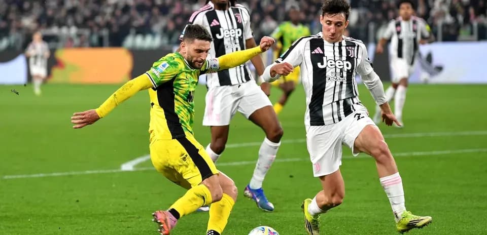 Juventus player tackling opponent during match action