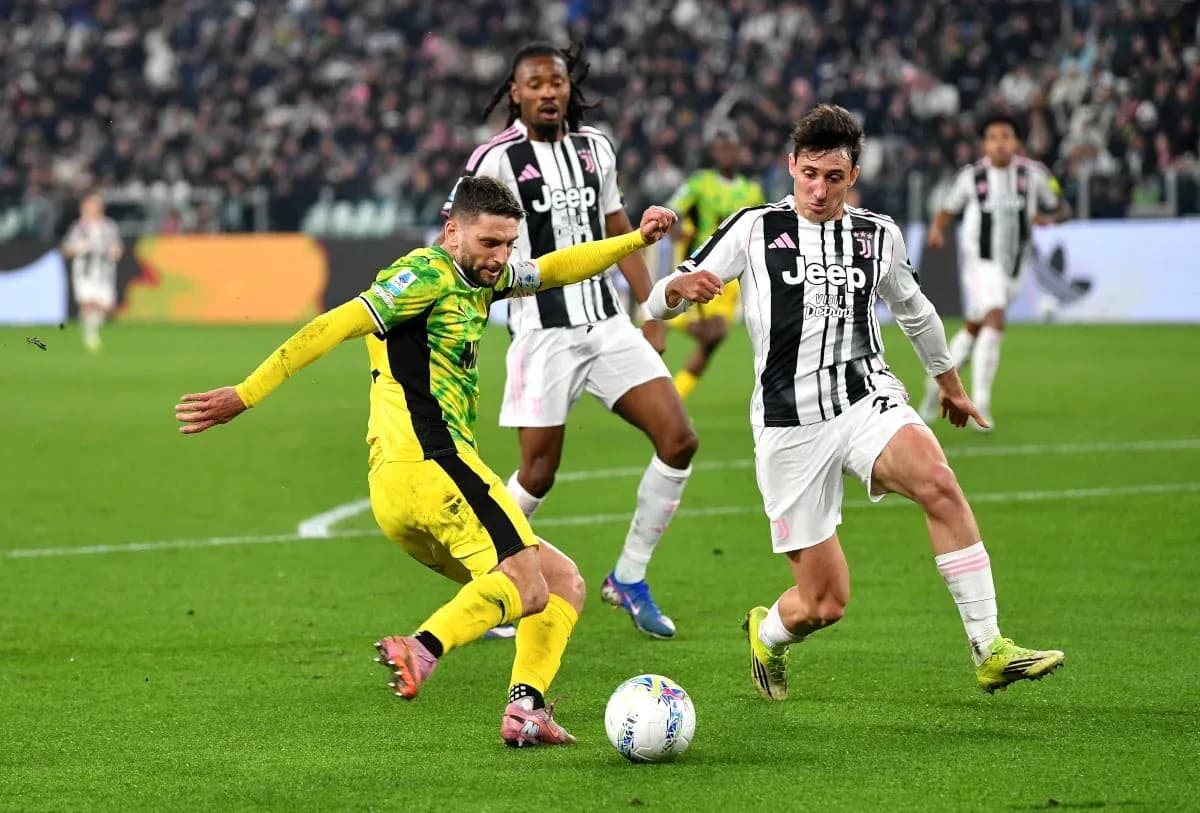 Juventus player tackling opponent during match action